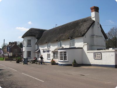 Picture of Blue ball Inn. Daytime, Thatched building.